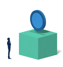 man next to a green box with a blue coin on top